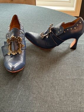 John Fluevog Navy Leather Heeled Loafers with Ornate Gold Buckles